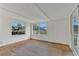Living room with multiple windows and wood floors at 2045 South St, Oviedo, FL 32765