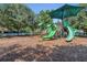 Community playground featuring a green shade structure and multiple slides at 2045 South St, Oviedo, FL 32765
