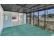 Screened in porch with outdoor access featuring green carpet and neutral tones at 2045 South St, Oviedo, FL 32765