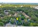 Overhead shot of a neighborhood boasting mature trees and green landscaping and showing the property location at 209 Sweet Gum Way, Longwood, FL 32779