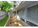Long wooden deck on back of house with windows and greenery at 209 Sweet Gum Way, Longwood, FL 32779