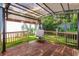 Backyard features a wooden deck with an awning, chairs, and artificial turf at 209 Sweet Gum Way, Longwood, FL 32779
