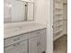 Bathroom featuring modern vanity with marble countertop and open shelving at 209 Sweet Gum Way, Longwood, FL 32779