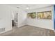 Bright bedroom with carpet, fan, connected bathroom, and large window at 209 Sweet Gum Way, Longwood, FL 32779