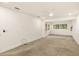 Neutral bedroom featuring carpet, white trim, fan, and large windows at 209 Sweet Gum Way, Longwood, FL 32779