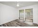 Bedroom featuring wood floors, white trim, and large windows at 209 Sweet Gum Way, Longwood, FL 32779