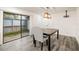 Cozy dining area features a table, chairs, and sliding glass doors leading to outdoor space at 209 Sweet Gum Way, Longwood, FL 32779
