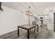 Bright dining area features a table and chairs and open view into the kitchen at 209 Sweet Gum Way, Longwood, FL 32779