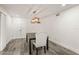 Cozy dining area features a table, upholstered chair and modern light fixture at 209 Sweet Gum Way, Longwood, FL 32779