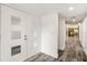 Clean, open entryway features wood-look tile flooring with natural light and neutral wall paint at 209 Sweet Gum Way, Longwood, FL 32779
