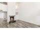 Open living area features a fireplace, hardwood floors, and bright white walls at 209 Sweet Gum Way, Longwood, FL 32779