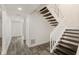 Home interior featuring staircase and wood-look tile flooring, offering a blend of modern design and functionality at 209 Sweet Gum Way, Longwood, FL 32779