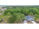 Aerial view of the house and neighborhood in a wooded area at 2137 Brighton Ln, Orlando, FL 32817