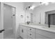 Elegant bathroom with double sinks, stylish lighting, and a tiled shower/tub combo at 2137 Brighton Ln, Orlando, FL 32817