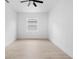 Spacious bedroom with light hardwood floors and a ceiling fan at 2137 Brighton Ln, Orlando, FL 32817