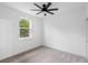 Bright bedroom featuring a ceiling fan, window, and neutral carpet at 2137 Brighton Ln, Orlando, FL 32817