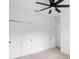 White bedroom featuring a ceiling fan, carpet, and closet with sliding doors at 2137 Brighton Ln, Orlando, FL 32817