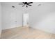Bright bedroom with hardwood floors, ceiling fan, and white trim at 2137 Brighton Ln, Orlando, FL 32817