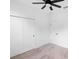 Spacious bedroom featuring carpeted floors, neutral walls, and closet doors at 2137 Brighton Ln, Orlando, FL 32817