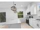 Bright, modern kitchen featuring an island, stainless steel appliances, and modern light fixtures at 2137 Brighton Ln, Orlando, FL 32817