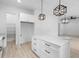 Bright kitchen with white cabinets, island and stainless steel appliances at 2137 Brighton Ln, Orlando, FL 32817