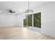 Bright living room with ceiling fan and view to yard at 2137 Brighton Ln, Orlando, FL 32817