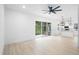 Bright living room with ceiling fan and view to the yard at 2137 Brighton Ln, Orlando, FL 32817