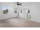 Loft with carpeted floors, neutral walls, large windows and staircase with white railing at 2137 Brighton Ln, Orlando, FL 32817