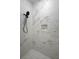 Modern bathroom features a sleek, tiled shower with a rainfall showerhead and built-in niche at 2137 Brighton Ln, Orlando, FL 32817