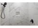 Contemporary shower featuring large white marble tiles and black hardware at 2137 Brighton Ln, Orlando, FL 32817