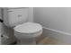 Close-up view of a modern, white toilet with a smooth, closed lid at 2137 Brighton Ln, Orlando, FL 32817