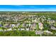 Sprawling aerial view of a residential community with lush landscaping and nearby amenities at 2157 Cypress Villas Dr, Orlando, FL 32825
