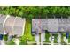 Aerial view of a property featuring lush green space, a courtyard, and convenient parking at 2157 Cypress Villas Dr, Orlando, FL 32825