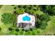 Aerial view of a private pool and landscaped backyard with seating and dining areas at 2157 Cypress Villas Dr, Orlando, FL 32825