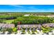 Aerial shot of townhomes surrounded by lush greenery and serene lakes at 2157 Cypress Villas Dr, Orlando, FL 32825