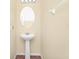 Cozy bathroom with pedestal sink, and classic lighting fixture at 2157 Cypress Villas Dr, Orlando, FL 32825