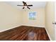 Bedroom featuring a ceiling fan, laminate wood flooring, and a window overlooking a landscape at 2157 Cypress Villas Dr, Orlando, FL 32825