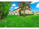 Green lawn behind condo building with lush landscape at 2157 Cypress Villas Dr, Orlando, FL 32825