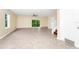 Spacious living room with tile floors, ceiling fan, and sliding glass doors to the outside at 2157 Cypress Villas Dr, Orlando, FL 32825