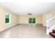 Spacious living room with tile floors, ceiling fan, and sliding glass doors to the outside at 2157 Cypress Villas Dr, Orlando, FL 32825