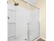 Bathroom shower featuring glass sliding doors and a modern shower head at 2157 Cypress Villas Dr, Orlando, FL 32825