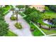Inviting street view of homes with lush landscaping, mature trees, and beautiful neighborhood charm at 2157 Cypress Villas Dr, Orlando, FL 32825