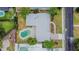 Aerial view of a home featuring a backyard pool and a well-maintained yard with mature trees at 2171 Chippewa Trl, Maitland, FL 32751