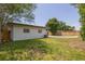 Lush backyard featuring a well-maintained lawn and a private pool area at 2171 Chippewa Trl, Maitland, FL 32751