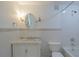 Updated bathroom with marble vanity, subway tile, and decorative lighting at 2171 Chippewa Trl, Maitland, FL 32751