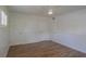 Well-lit bedroom featuring vinyl floors, bright windows with shutters, and ample closet space for comfortable living at 2171 Chippewa Trl, Maitland, FL 32751