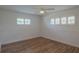 Comfortable bedroom boasts bright windows with shutters, a ceiling fan, and vinyl floors, creating a relaxing atmosphere at 2171 Chippewa Trl, Maitland, FL 32751