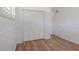 Light-filled bedroom with hardwood floors and a spacious closet, designed for efficient storage and comfort at 2171 Chippewa Trl, Maitland, FL 32751