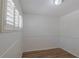 Cozy bedroom features modern window shutters, white walls, and vinyl flooring, perfect for relaxation and style at 2171 Chippewa Trl, Maitland, FL 32751