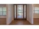 Entryway with wood floors, a front door with large sidelights, and views into other rooms at 2171 Chippewa Trl, Maitland, FL 32751